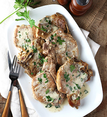 Pork Chops in Brandy Cream Herb Sauce